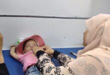 توقيع الكشف الطبي على ٧١٩ طفلاً خلال قافلة سكانية مجانية بعزبة الوصفية بكفر الدوار